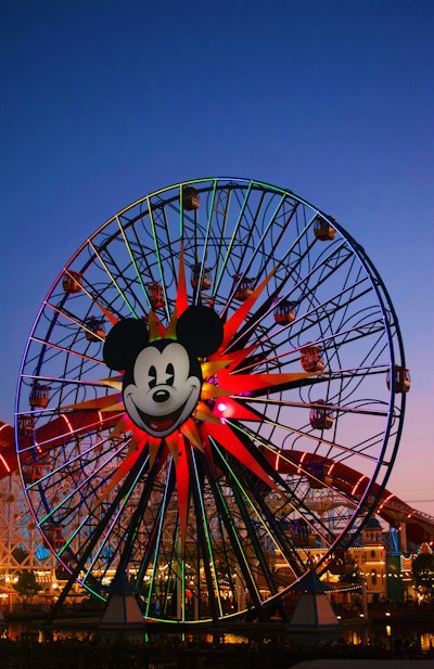 white and red ferris wheel under blue sky during daytime