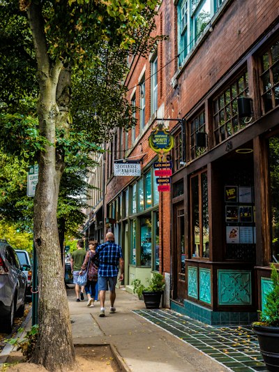 people walking on a sidewalk