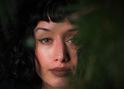 woman with black hair and green eyes