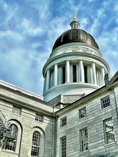 a building with a dome and columns