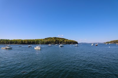 white motorboat in body of water during daytime