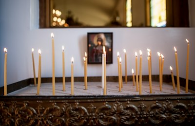 white candles on brown wooden table