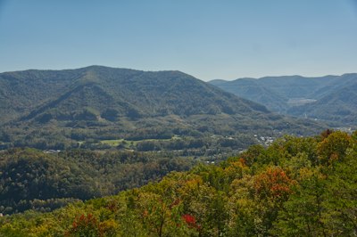 Mountains, trees, and a clear blue sky