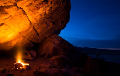 a campfire in the middle of a desert at night