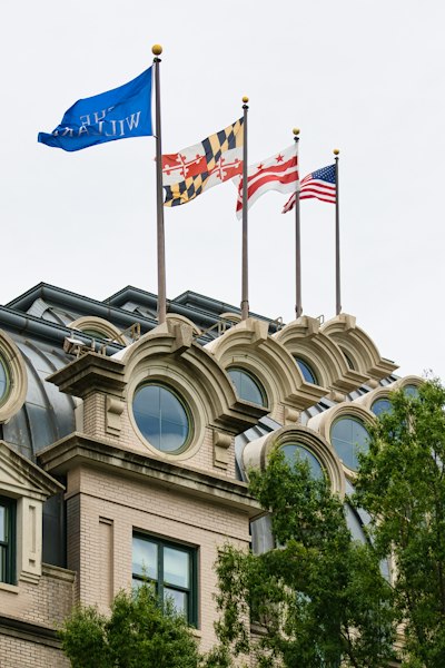 Flags flying on building with dormer windows in washington