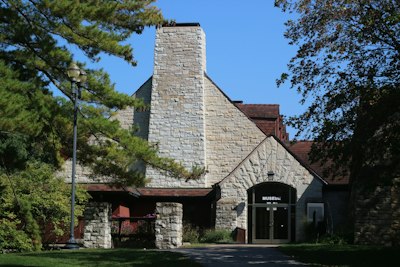 a stone building with a clock tower on top of it