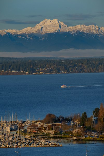 a large body of water with a mountain in the background
