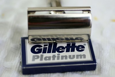 Silver safety razor on a box of gillette platinum blades