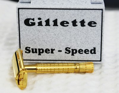A gold gillette super-speed razor with its box