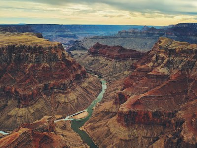 The Colorado River winding through the deep red rock canyons of the Grand Canyon
