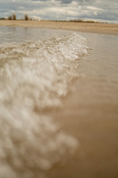 a person riding a surfboard on top of a body of water