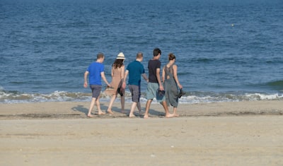 group of people on beach during daytime