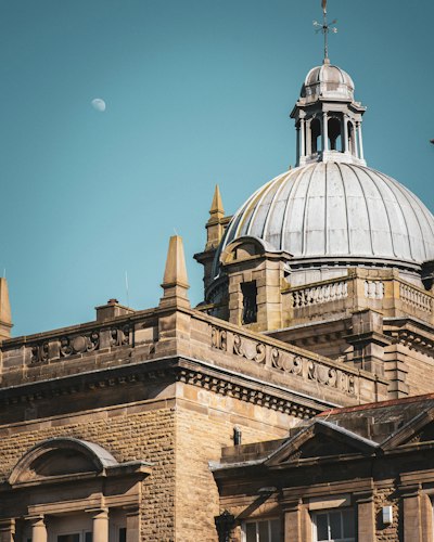 a building with a dome and a clock on it