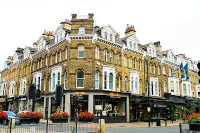 a tall building with many windows on the front of it