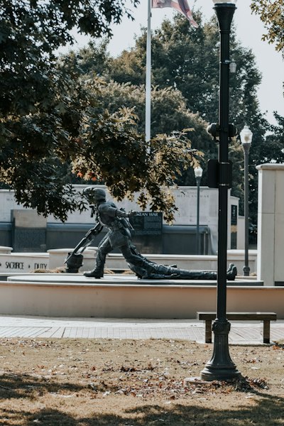 a statue of a hockey player on a bench