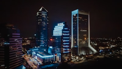a city at night with a lot of tall buildings