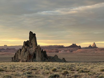 a large rock formation in the middle of a desert