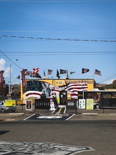 A yellow building with american flags on it