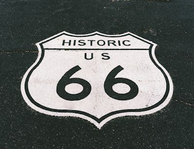 a close up of a street sign on the ground