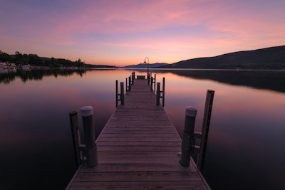 a dock that is next to a body of water