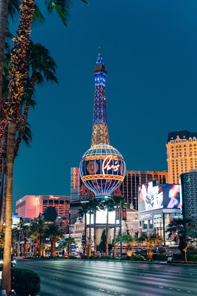 the eiffel tower in las vegas is lit up at night