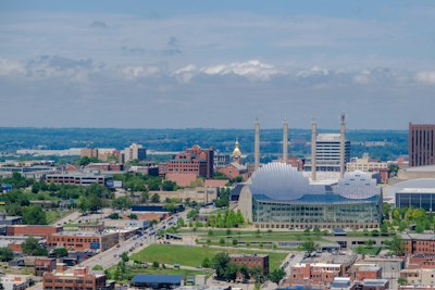 Modern domed building stands out in a sprawling urban cityscape
