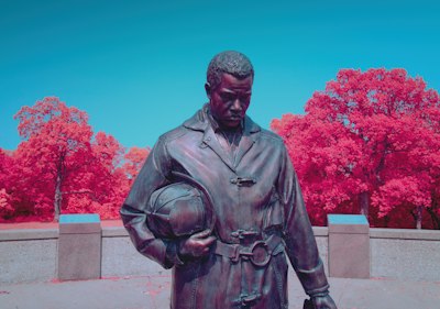 A statue of a man holding a baby in his arms