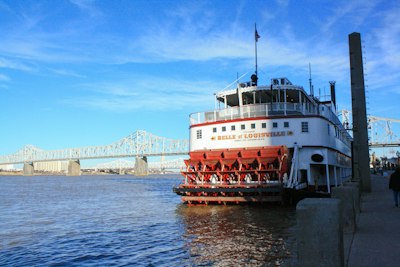 white and red ship on sea under blue sky during daytime