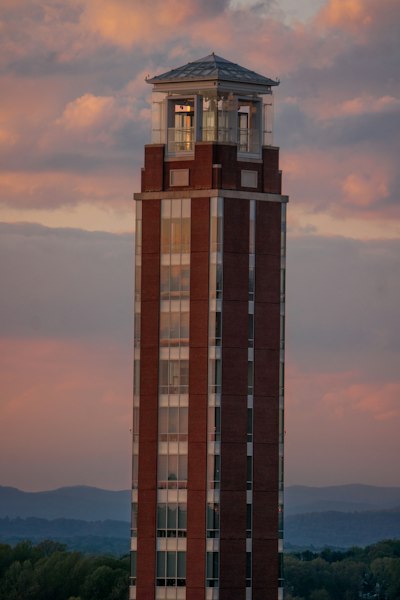 a tall building with a clock on the top of it
