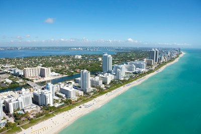 An aerial view of the coastline and high-rise buildings in Miami Beach, Florida