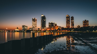 high-rise buildings near calm body of water