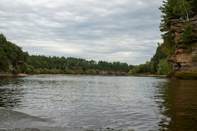 a body of water with trees around it