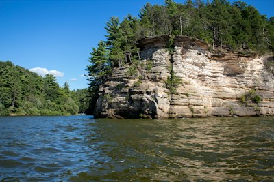 a cliff with trees on it