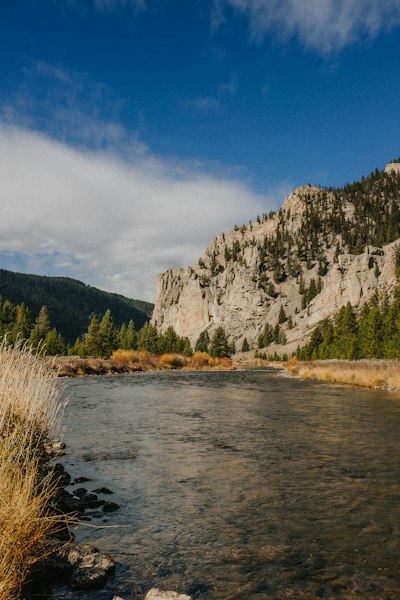 a body of water surrounded by mountains and trees