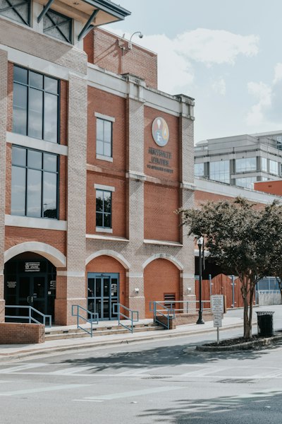 a large brick building with a clock on the front of it