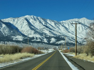 a road with a mountain in the background