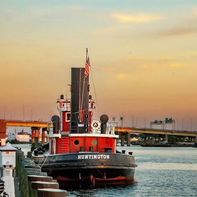 A large boat floating on top of a body of water