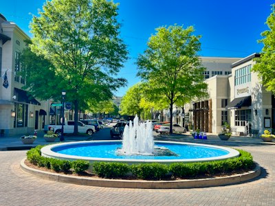 a fountain in the middle of a city square