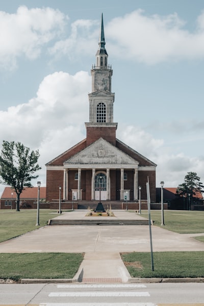 a church with a steeple and a clock tower