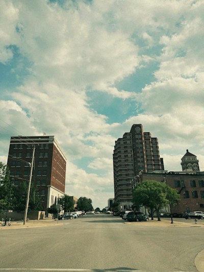 a city street with cars parked on the side of it