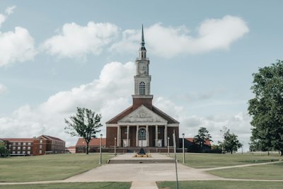 a church with a steeple and a clock tower