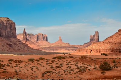 Red sandstone buttes and mesas rising from a desert landscape in Monument Valley