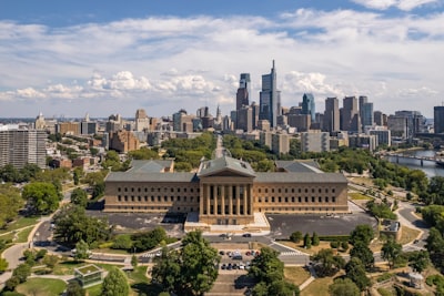 a large building with a city in the background