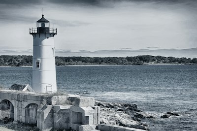 a lighthouse on a rocky shore