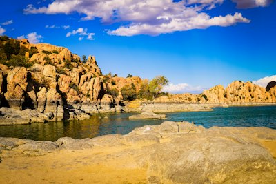 a body of water surrounded by large rocks
