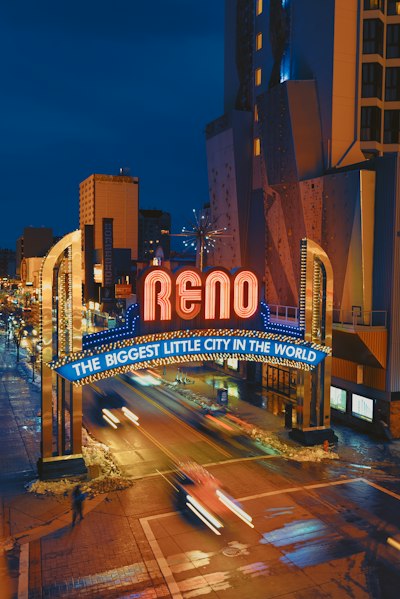 a neon sign that reads reno the biggest little city in the world