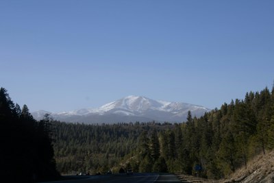 a road with a mountain in the background