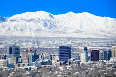 a view of a city with mountains in the background