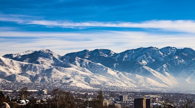 a view of a city with mountains in the background