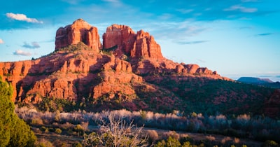 brown rocky mountain under blue sky during daytime